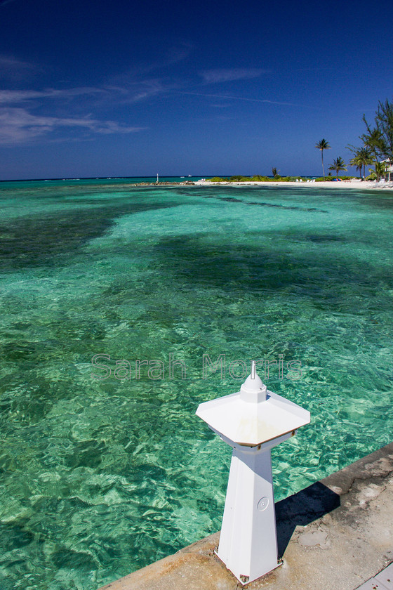 Rum-Point 
 View from Rum Point jetty, Grand Cayman, with crystal clear green water and deep blue sky 
 Keywords: Rum Point jetty, Grand Cayman, crystal, clear, green, water, deep, blue, sky, exotic, idyllic, paradise, tropical